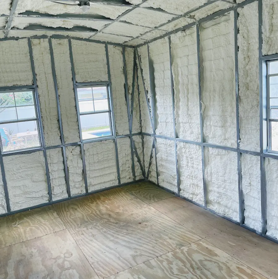 Closed-cell spray foam insulation applied to wall cavities in a residential project in Manasquan